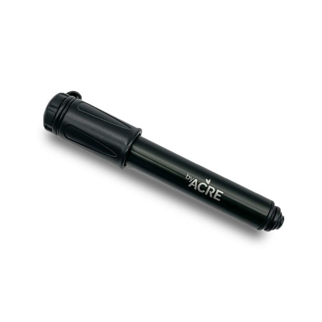 A sleek black cylindrical hand pump labeled by ACRE in white text, with a nozzle and easy-grip handle, expertly designed for effortless inflation as part of the ByAcre Accessories for Overland Carbon Fiber Rollators.